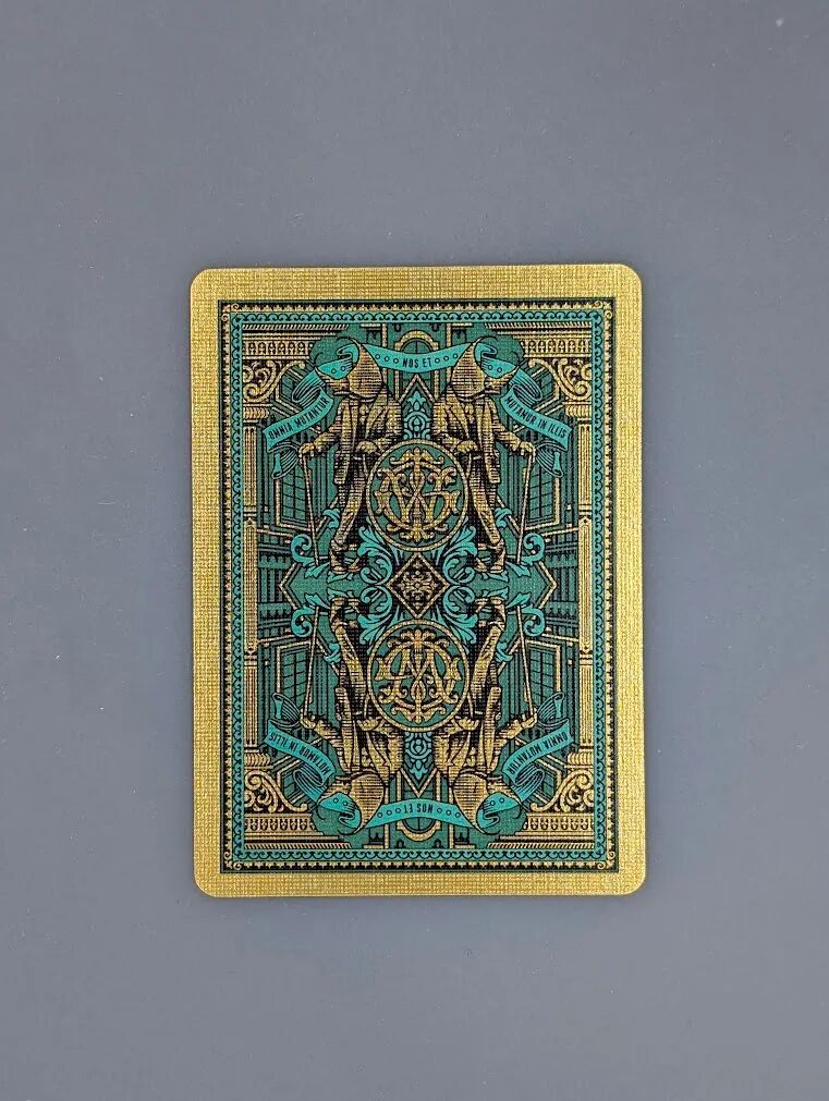 Dynastinae Back Design, Depicting the Brand Owner's Monogram Guarded by Highly Stylized Rhinoceros Beetle Elements, Emphasizing a Sense of Form and Order.